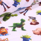 Tissu Coton imprimé sous licence Bio Toy Story sur fond Blanc - Par 10 cm