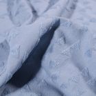 Tissu Jersey Coton Triangles en relief sur fond Bleu - Par 10 cm