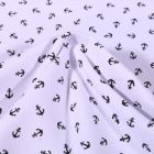 Tissu Jersey Piqué de coton spécial Polo Ancres marines sur fond Blanc - Par 10 cm