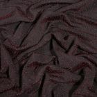 Tissu Jersey pailleté rouge sur fond Noir - Par 10 cm